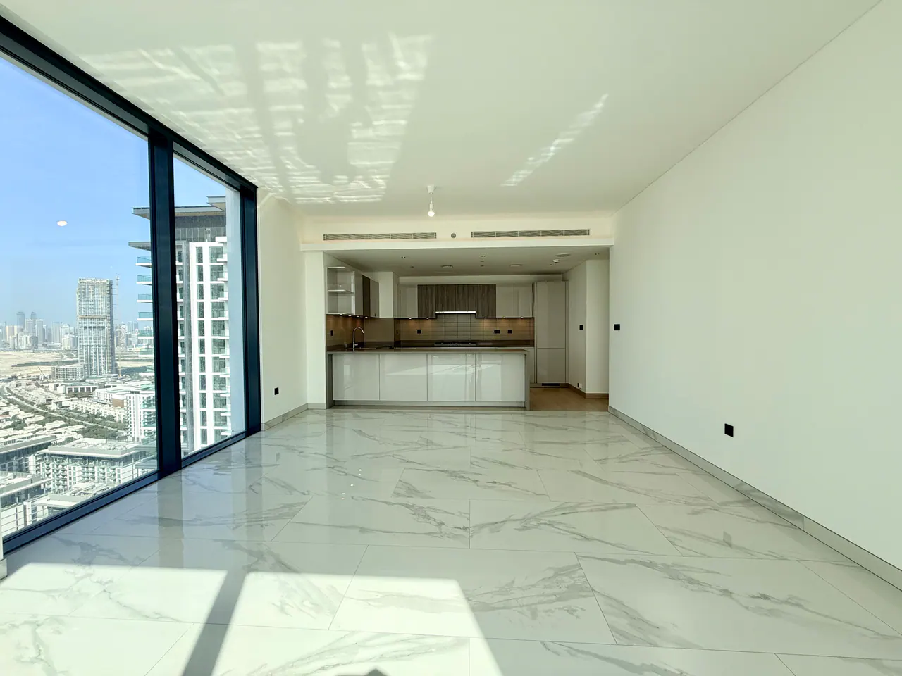 Crest Grande A3102 — living and dining with skyline view